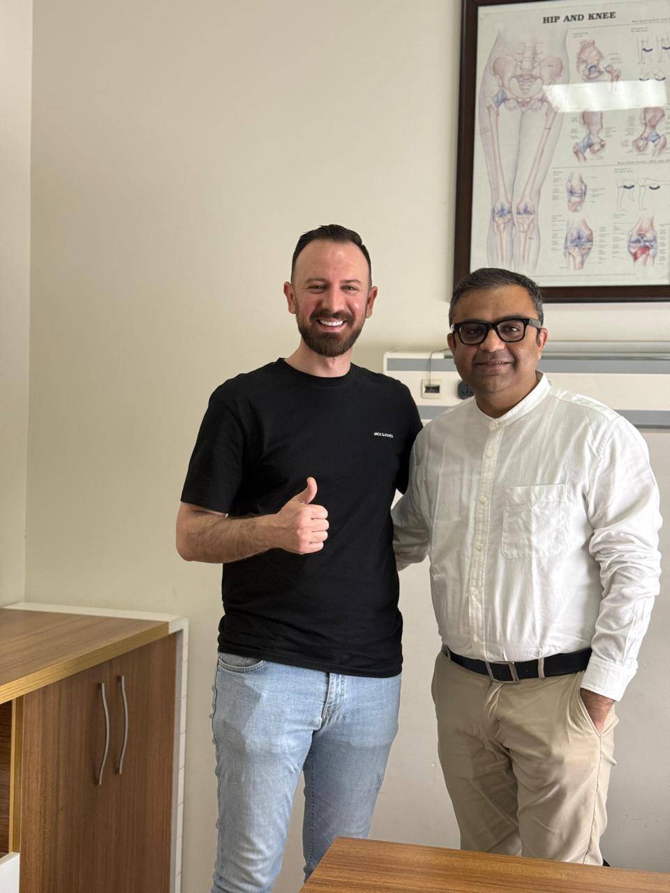 Dr. Ankur Singh with happy international patient giving thumbs up