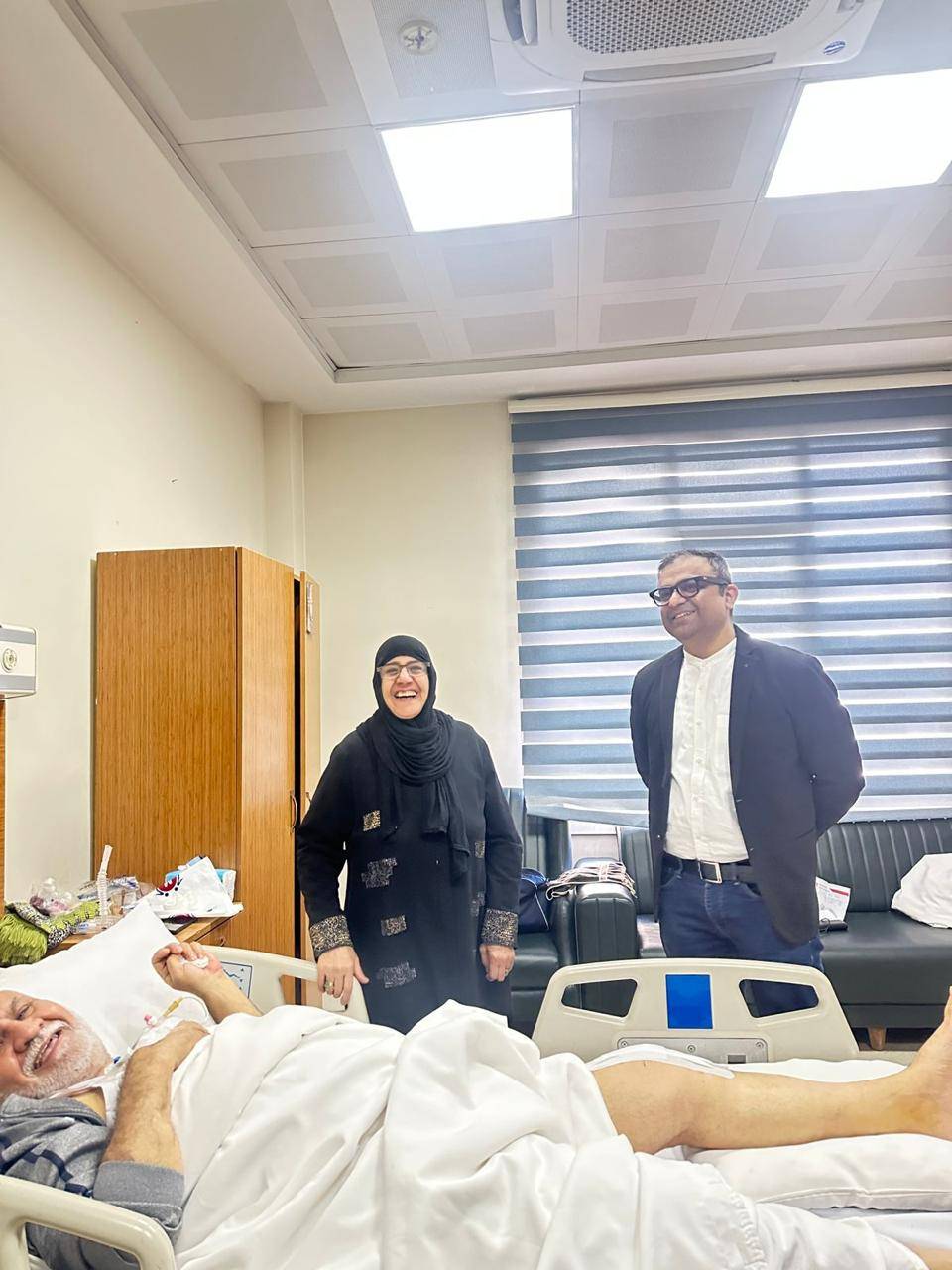 Dr. Ankur Singh with recovering international knee surgery patient and family